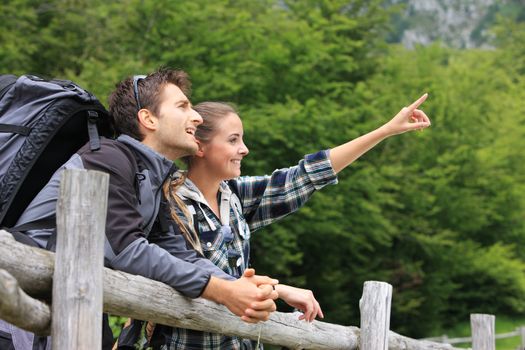 Portrait of young couple hikers enjoying nature