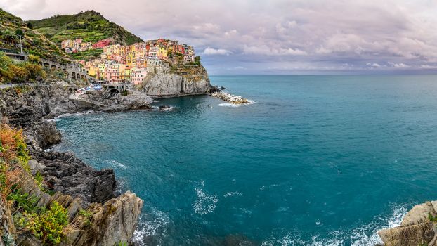 Panoramic view of colorful village Manarola in Cinque Terre, Italy