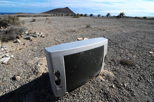 A Broken Gray Television Abandoned in the Desert