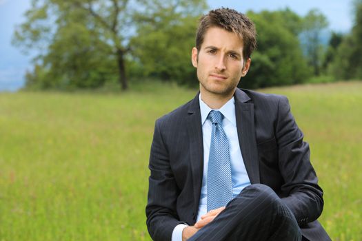 Portrait of a young business man outdoors