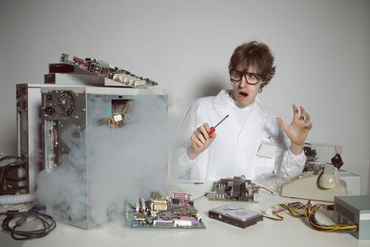 Computer technician is trying to repair a computer 