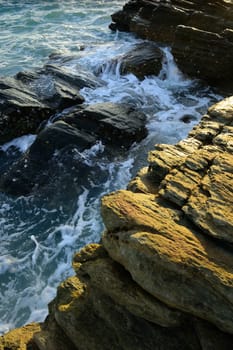 beautiful seascape of wave and rock at the sunset