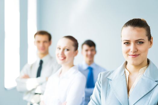 successful businessmen, a portrait of a business woman standing next to colleagues