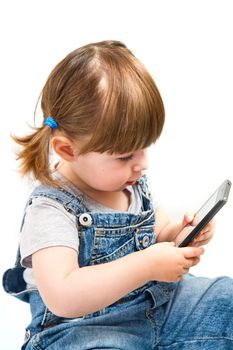 little girl play with mobile phone on white background