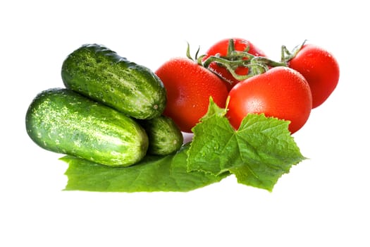 Tomatoes and cucumbers isolated on white background