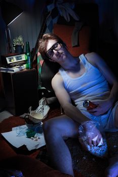 Guy in underwear lies slumped on the floor.