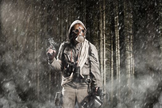 Soldier wearing a gas mask is fighting in a forest