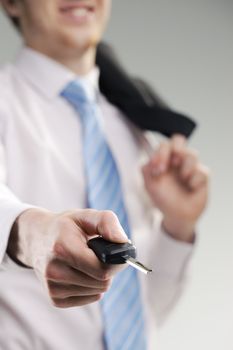 close up of a businessman hand with car key