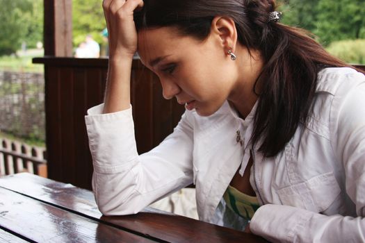 Closeup portrait of young woman looking depressed