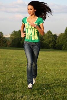 Young woman in blue jeans and cell shirt