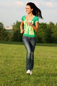 Young woman in blue jeans and cell shirt