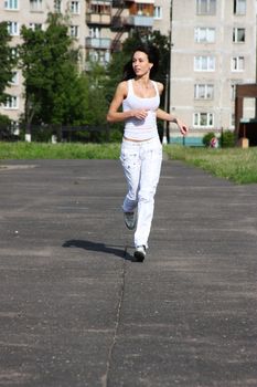 Fitness young woman in white