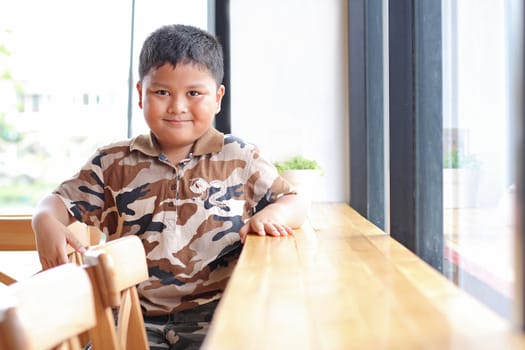 Boy with a cheerful expression.