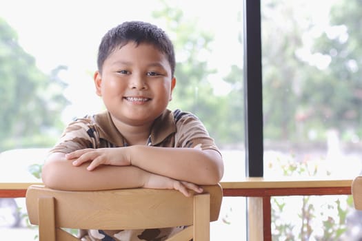 Boy with a cheerful expression.