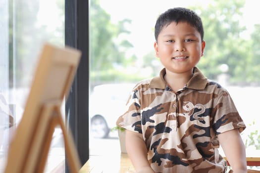 Boy with a cheerful expression.