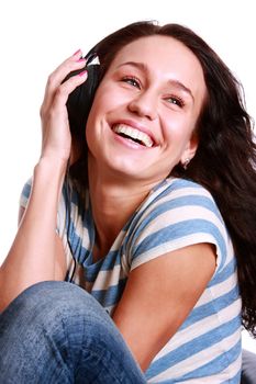 Happy young woman listening to music