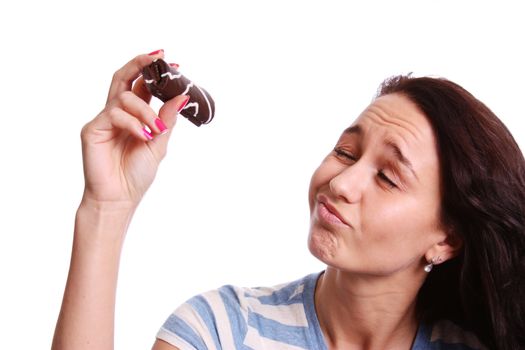 Young beautiful woman eating Cake