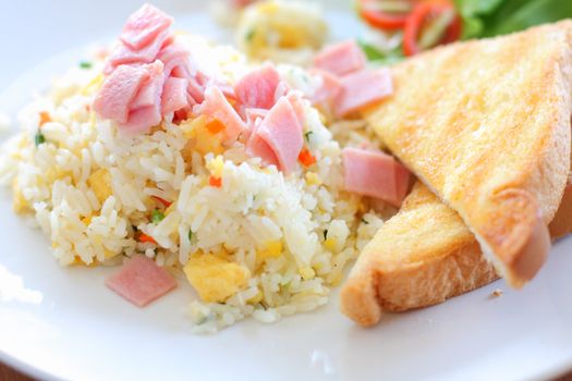 Fried rice with ham, served with toast