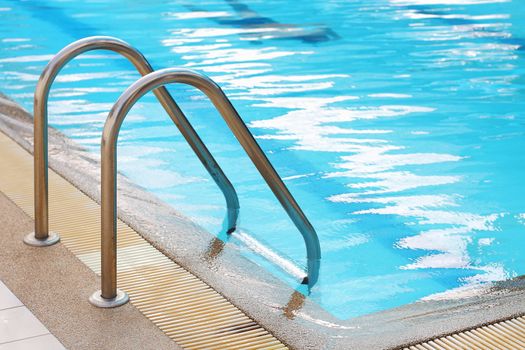 railing stairs down to the pool with fresh water