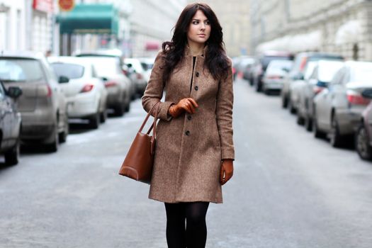 beautiful young woman walking on the street