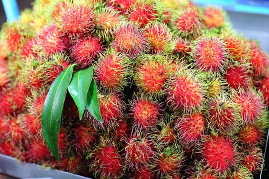 Rambutan (tropical fruit) on sales in the market