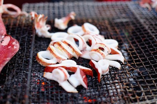 seafood barbecue of grilled squid on charcoal oven