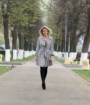 beautiful young woman walking on the street