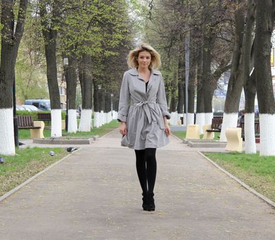 beautiful young woman walking on the street