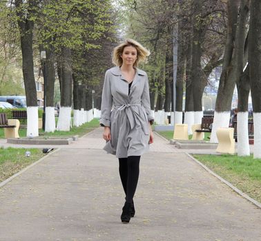 beautiful young woman walking on the street