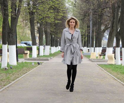 beautiful young woman walking on the street