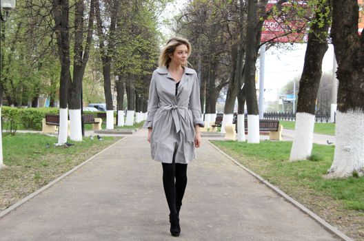 beautiful young woman walking on the street