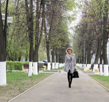 beautiful young woman walking on the street