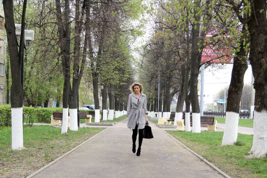 beautiful young woman walking on the street