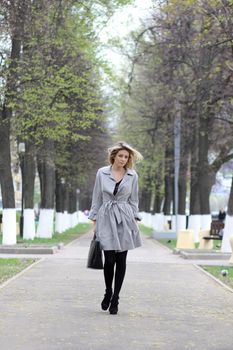 beautiful young woman walking on the street