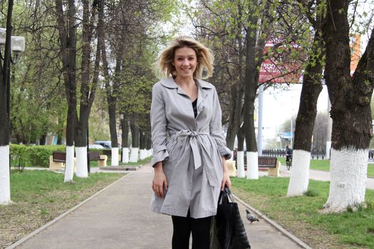 beautiful young woman walking on the street