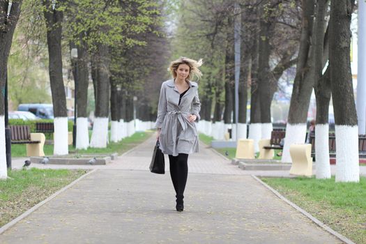 beautiful young woman walking on the street