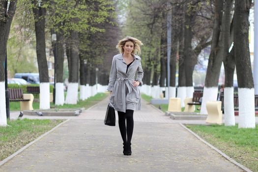beautiful young woman walking on the street