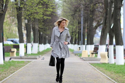 beautiful young woman walking on the street