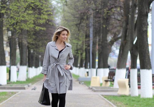 beautiful young woman walking on the street