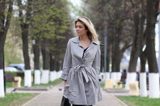 beautiful young woman walking on the street