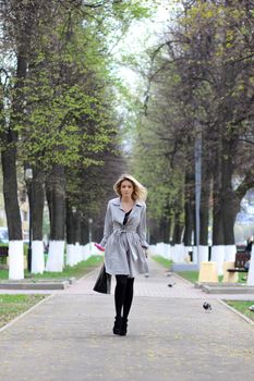 beautiful young woman walking on the street