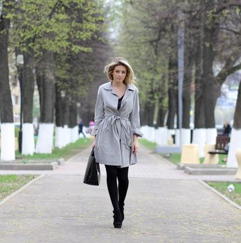beautiful young woman walking on the street