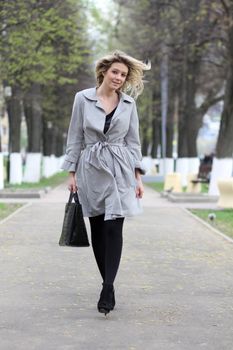 beautiful young woman walking on the street