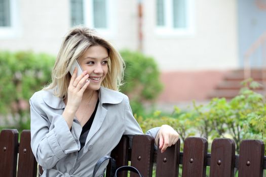 portrait of young woman talking on mobile phone