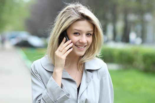 portrait of young woman talking on mobile phone