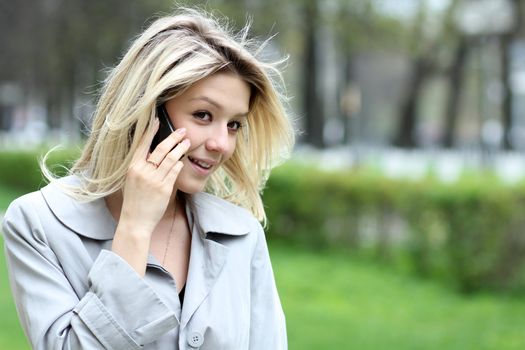 portrait of young woman talking on mobile phone