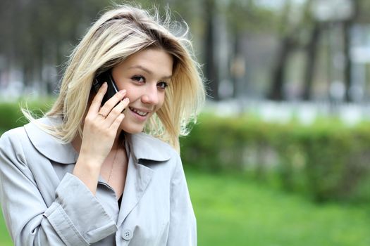 portrait of young woman talking on mobile phone