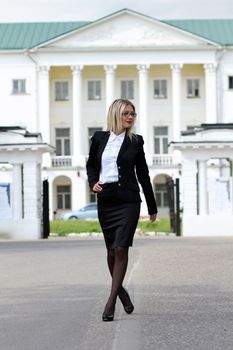 beautiful young woman walking on the street