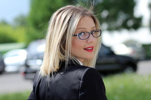 Beautiful young woman in sunglasses. Outdoor portrait