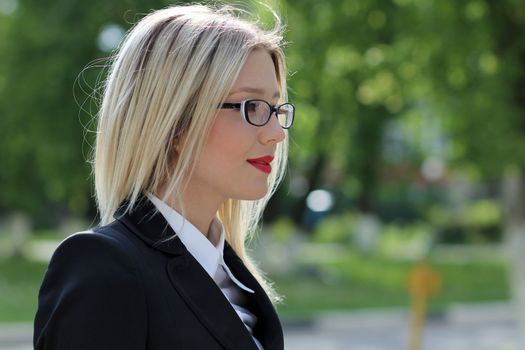 Beautiful young woman in sunglasses. Outdoor portrait